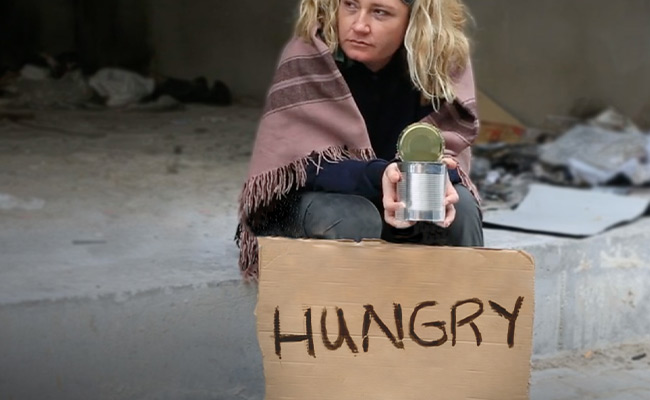 Hungry person sitting with sign